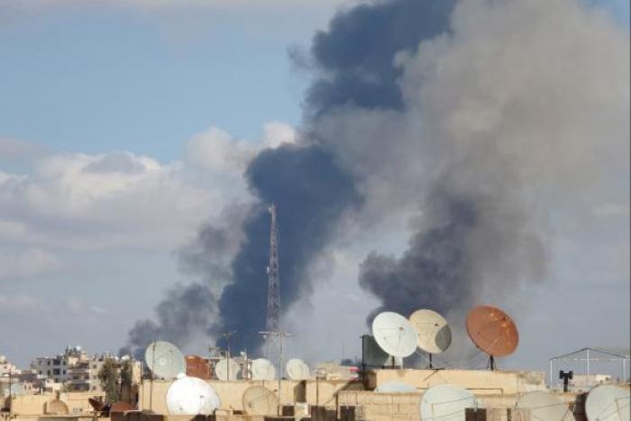 Smoke rises after what activists said were airstrikes by forces loyal to Syria's President Bashar al-Assad in Raqqa, eastern Syria, which is controlled by the Islamic State November 25, 2014.