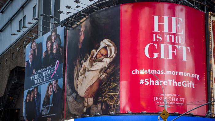 The Christmas initiative titled 'He is the gift,' an ad campaign by the Church of Jesus Christ of Latter-day Saints for the 2014 Christmas season, seen in New York City's Times Square.