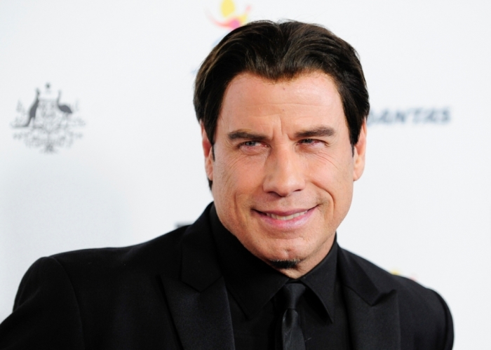 Actor John Travolta arrives during the G'Day USA Black Tie Gala in Los Angeles, California, January 11, 2014.