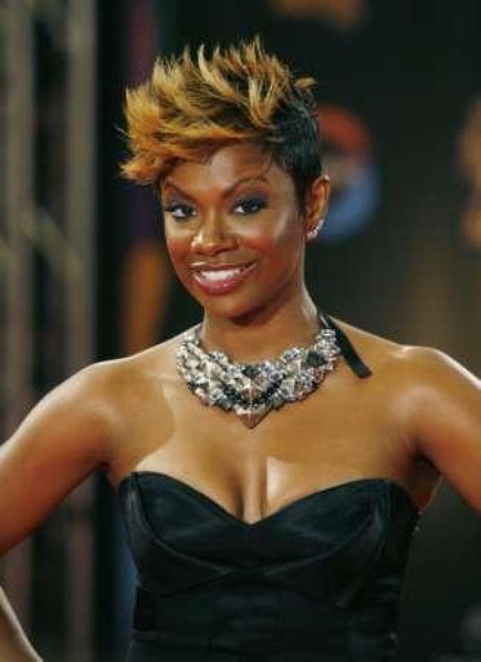 Singer Kandi Burruss from the Atlanta Housewives reality show poses on the red carpet as she arrives for the Soul Train Awards in Atlanta, Georgia November 3, 2009.