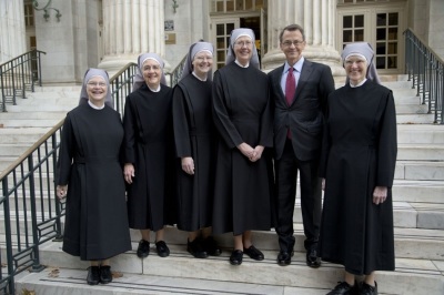 Members of a Catholic order of nuns known as the Little Sisters of the Poor stand outside the Tenth Circuit Court of Appeals building in Denver, Colorado, along with William Mumma, President of the Becket Fund.