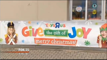 A Toys "R" Us banner sits outside of a store in Framingham, Mass.