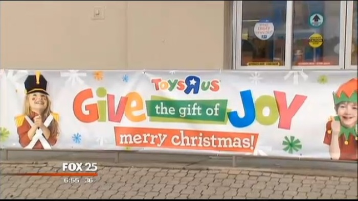A Toys 'R' Us banner sits outside of a store in Framingham, Mass.
