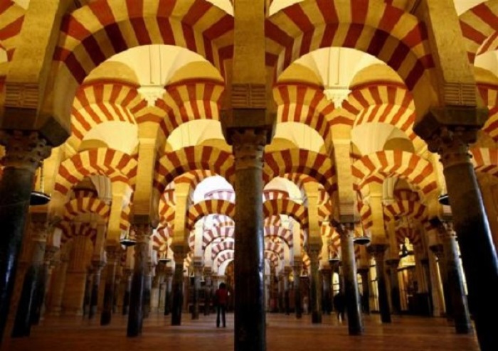 A woman stands in the former Mosque of Cordoba in Cordoba in this January 20, 2007 file photo.