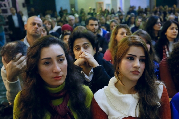 Iraqi Christian refugees attend a service at a church in Hazmiyeh, near Beirut, Lebanon, December 12, 2014. Iraqi Christians who sought refuge in Lebanon after Islamist militants tore through their homeland said they had no idea when they would be able to return as they gathered for prayers ahead of Christmas.
