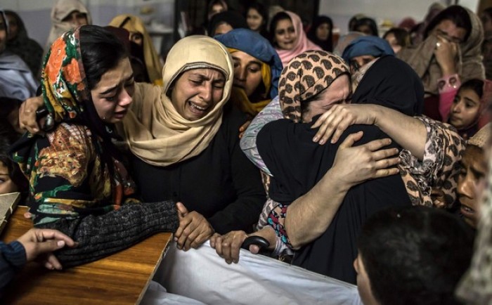 Women mourn their relative Mohammed Ali Khan, 15, a student who was killed during an attack by Taliban gunmen on the Army Public School, at his house in Peshawar Dec 16, 2014.