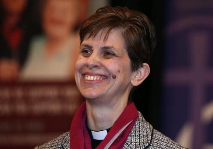 Libby Lane, a suffragan (Assistant) bishop in the Diocese of Chester, smiles as her forthcoming appointment as the new Bishop of Stockport is announced in the Town Hall in Stockport, northern England December 17, 2014.