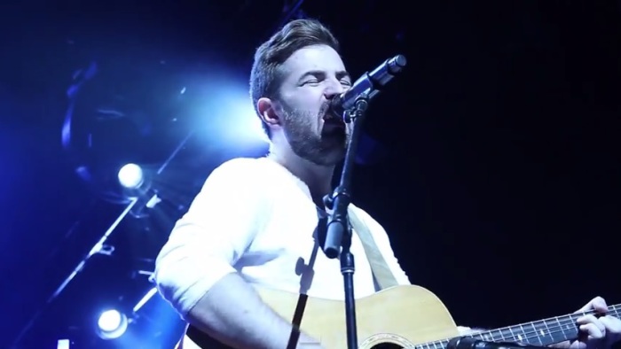 Worship leader John Coggins performs at ChristmasLand's Hillsong Concert at the Nokia Theater in Los Angeles, Dec. 10, 2014.