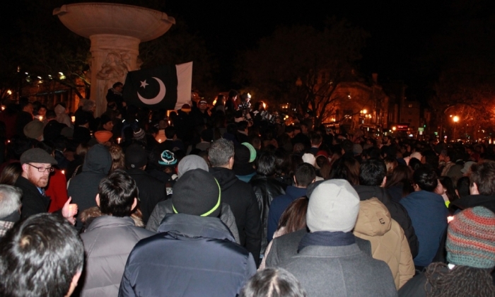 People gather at the Dupont Circle fountain in Washington, D.C. for a vigil in remembrance of the more than 140 people killed in a terrorist attack at the military-run Army Public School in Peshawar, Pakistan. The vigil was held Wednesday, December 17, 2014.