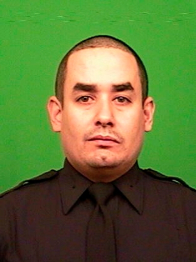 New York Police Officer Rafael Ramos, 40, is seen in an undated picture provided by the New York Police Department December 20, 2014. A gunman ambushed and fatally shot two New York City police officers on Saturday identified the as Ramos, 40, and Wenjian Liu, 32. Ramos had a 13-year-old son.