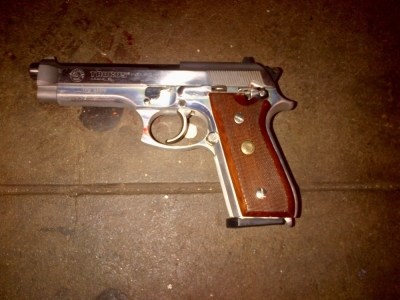 A silver semi-automatic Taurus firearm, which police said was recovered on the subway platform near the body of 28-year-old shooting suspect Ismaaiyl Brinsley, is seen in a photograph provided by the New York Police Department December 20, 2014. Brinsley ambushed and fatally shot two New York City police officers on Saturday and then killed himself.