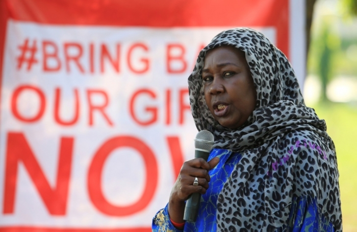 A campaigner from '#Bring Back Our Girls' addresses a rally calling for the release of the Abuja school girls who were abducted by Boko Haram militants, in Abuja, November 1, 2014. A man claiming to be Boko Haram leader Abubakar Shekau has said more than 200 girls kidnapped by the group six months ago were 'married off' to its fighters, contradicting Nigerian government claims they would soon be freed.