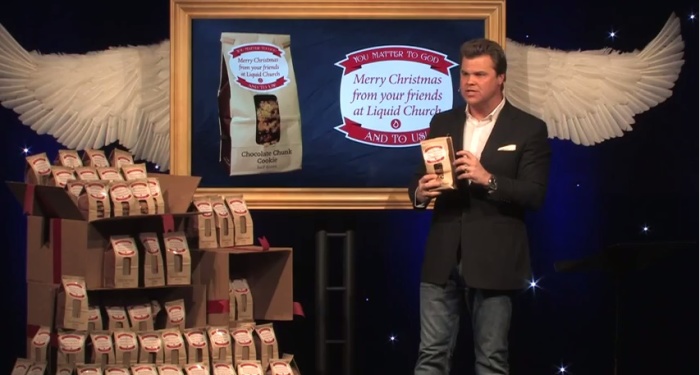Pastor Tim Lucas explains plans to distribute 12,000 bagged cookies to families in the New Jersey to those attending Christmas Eve services at Liquid church. The cookies came with a note and voucher for free hot meals at a local eatery, Dec. 24, 2014.