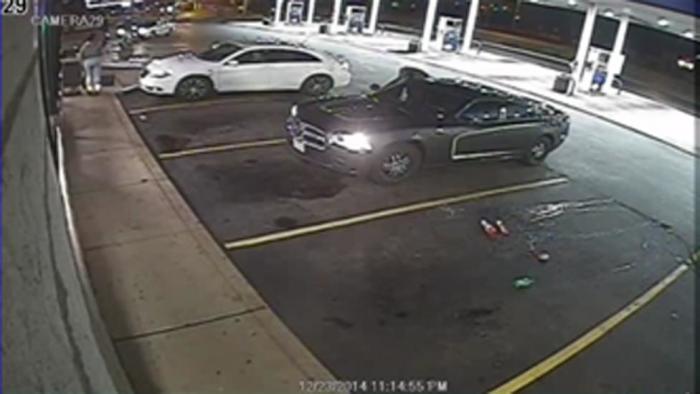 Surveillance video showing an officer-involved shooting during a routine business check at a gas station in Berkeley, Missouri, December 23, released by the St. Louis County Police Department on December 24, 2014.