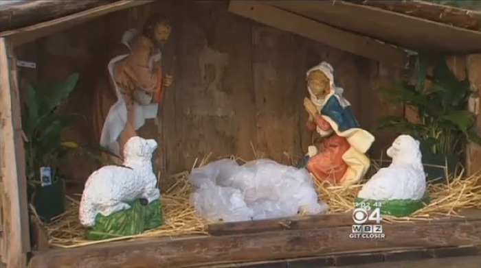 Police in Haverhill, Massachusetts, are treating the theft of a baby Jesus statue and replacement with a pig's head in a Nativity display in front of a church as a possible hate crime, Dec. 26, 2014.