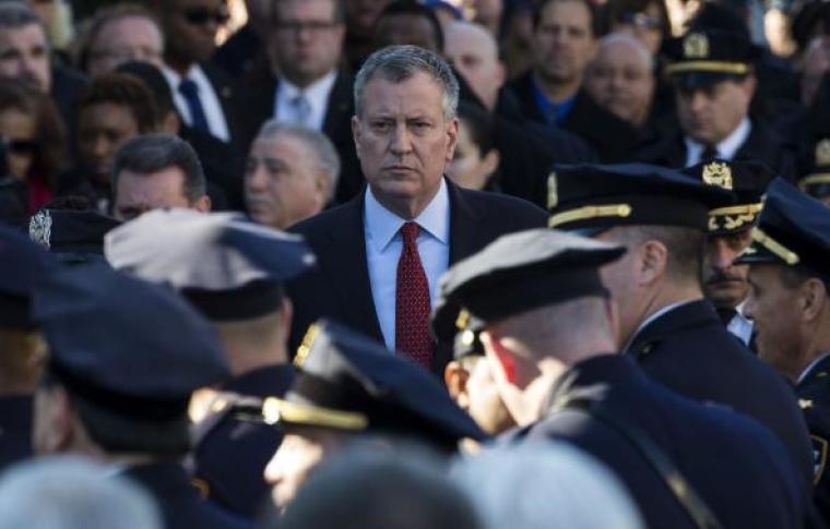 New York City Mayor Bill de Blasio exits the Christ Tabernacle Church following the funeral service for slain New York Police Department officer Rafael Ramos in the Queens borough of New York, December 27, 2014.