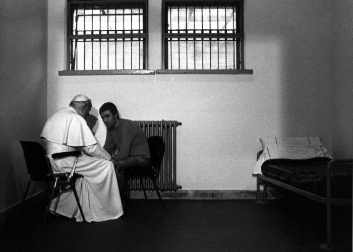 Pope John Paul II visits with Mehmet Ali Agca in a Roman prison in 1983 to let him know that he is forgiven for the shooting that left the Pope critically wounded.