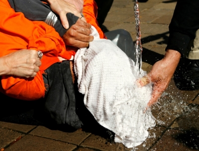 A demonstrator is held down during a simulation of waterboarding outside the Justice Department in Washington, in this file photo.