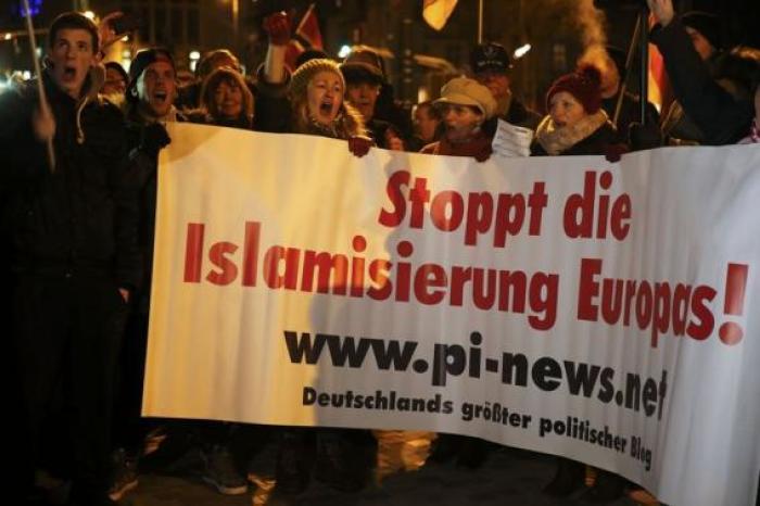 People take part in a march of a grass-roots anti-Muslim movement in Cologne January 5, 2015.