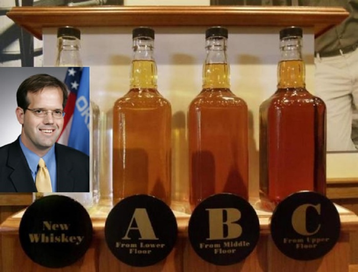 Bottles showing the barrel aging process are seen at the Jack Daniel's distillery in Lynchburg, Tennessee May 10, 2011. (Inset) Republican Sen. Patrick Anderson from Oklahoma.