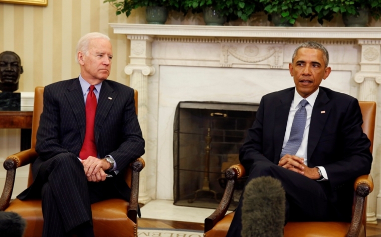 U.S. President Barack Obama (R) is joined by Vice President Joseph Biden as he makes a statement about the mass shooting in Paris, while in the Oval Office at the White House in Washington, January 7, 2015. Obama on Wednesday condemned the deadly shooting at a magazine office in Paris on Wednesday, calling it a terrorist attack against its ally, France.