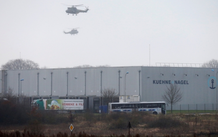 Helicopters with French intervention forces hover above the scene of a hostage taking at an industrial zone in Dammartin-en-Goele, northeast of Paris, January 9, 2015. The two main suspects in the weekly satirical newspaper Charlie Hebdo killings were sighted on Friday in the northern French town of Dammartin-en-Goele where at least one person had been taken hostage, a police source said.