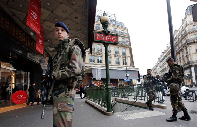 French soldiers patrol in the street near a department store in Paris as part of the highest level of 'Vigipirate' security plan in Paris January 10, 2015. French police searched for a female accomplice to militant Islamists behind deadly attacks on the satirical Charlie Hebdo weekly newspaper and a kosher supermarket and maintained a top-level anti-terrorist alert ahead of a Paris gathering with European leaders and demonstration set for Sunday. In the worst assault on France's homeland security for decades, 17 victims lost their lives in three days of violence that began with an attack on the Charlie Hebdo weekly on Wednesday and ended with Friday's dual hostage-taking at a print works outside Paris and kosher supermarket in the city.