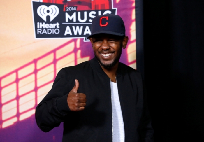 Hip hop recording artist Kendrick Lamar poses backstage during the iHeartRadio Music Awards in Los Angeles, California, May 1, 2014.