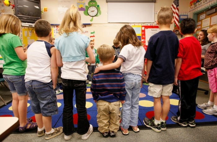 First grader Adam Kotzian (C) does a spelling drill with classmates in his classroom at Eagleview Elementary school in Thornton, Colorado, March 31, 2010.