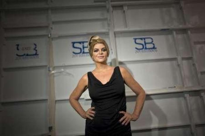 Actress Kirstie Alley poses for a photograph backstage before the Zang Toi Spring/Summer 2012 show during New York Fashion Week September 13, 2011.