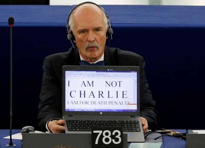 Polish Member of the European Parliament Janusz Korwin-Mikke displays the slogan 'I am not Charlie, I am for death penalty' on the screen of his computer in Strasbourg, France, January 12, 2015, during a debate on last week shootings by gunmen in Paris at the offices of the satirical weekly newspaper Charlie Hebdo, the killing of a police woman in Montrouge, and the hostage taking at a kosher supermarket at the Porte de Vincennes.