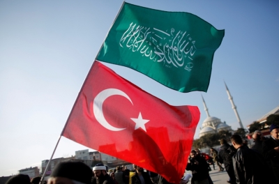 A demonstrator waves Turkish and Islamic flags in Istanbul, January 15, 2015.