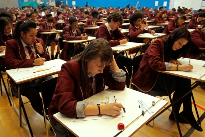 Pupils prepare at the start of a GCSE mathematics exam at the Harris Academy South Norwood in south east London, England, March 2, 2012