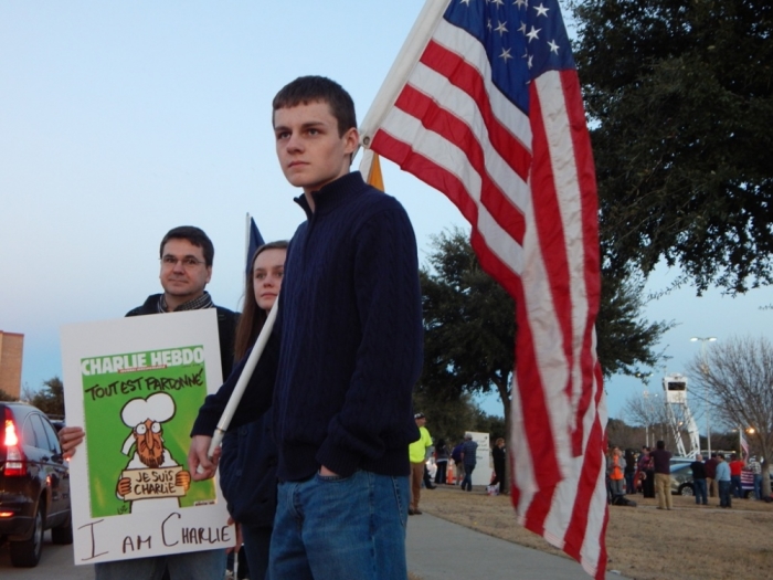 Protesters rally outside the 'Stand with the prophet against hate and terror' event sponsored by Sound Vision Foundation to 'challenge growing Islamophobia in American society,' at the Garland Independent School District's Curtis Culwell Center in Garland, Texas, January 17, 2015.