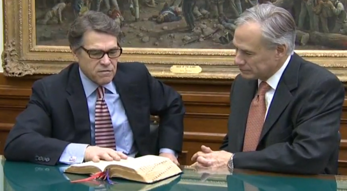 Texas Gov. Rick Perry discusses the Bible verse that he highlighted with his successor, Governor-elect Greg Abbott, in Austin, Texas, on January 19, 2015.