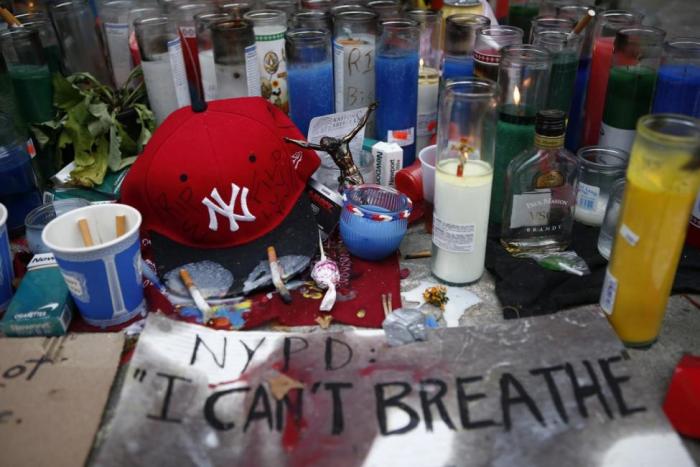 Candles are seen at the memorial of Eric Garner in Staten Island, New York, July 21, 2014.