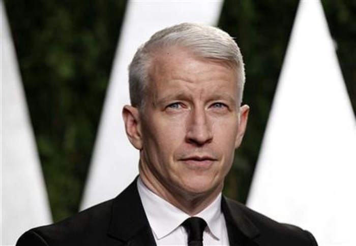 Journalist Anderson Cooper arrives at the 2012 Vanity Fair Oscar party in West Hollywood, California.