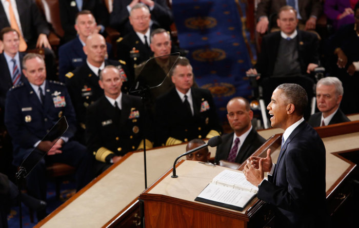 Members of the U.S. military's Joint Chief of Staff (L) listen as U.S. President Barack Obama delivers his State of the Union address to a joint session of the U.S. Congress on Capitol Hill in Washington, January 20, 2015.
