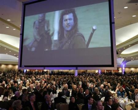 A scene from the movie "Braveheart" is shown as part of an introduction for filmmaker and writer Randall Wallace to speak at the National Prayer Breakfast in Washington, February 3, 2011.