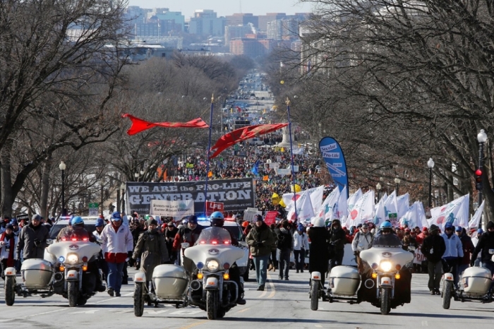Pro-life activists participate in the annual March for Life in Washington, January 22, 2014. Pope Francis used Twitter to back the annual anti-abortion rally, which was expected to draw hundreds of thousands of activists to Washington on Wednesday.