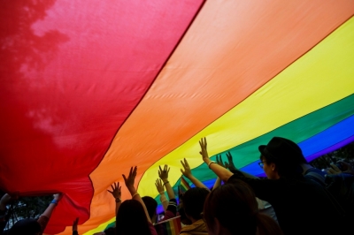Participants hold a giant rainbow flag during an LGBT pride parade in Hong Kong, China, November 8, 2014. Participants from the LGBT communities took to the streets on Saturday to demonstrate for their rights.