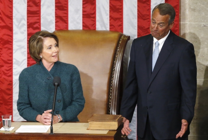 U.S. House Minority Leader Nancy Pelosi (D-CA) (L) makes remarks before handing the gavel to House Speaker John Boehner (R-OH) (R) after he was re-elected speaker on the House floor at the U.S. Capitol in Washington January 6, 2015.