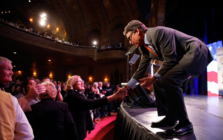 Former Governor of Texas Rick Perry greets supporters after speaking at the Freedom Summit in Des Moines, Iowa, January 24, 2015.