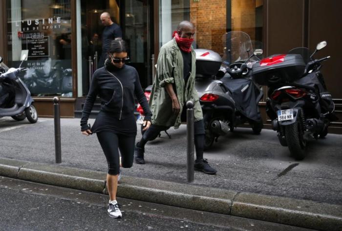 Hollywood stars like Kim Kardashian (seen here with her husband Kanye West) are often photographed wearing leggings in public
