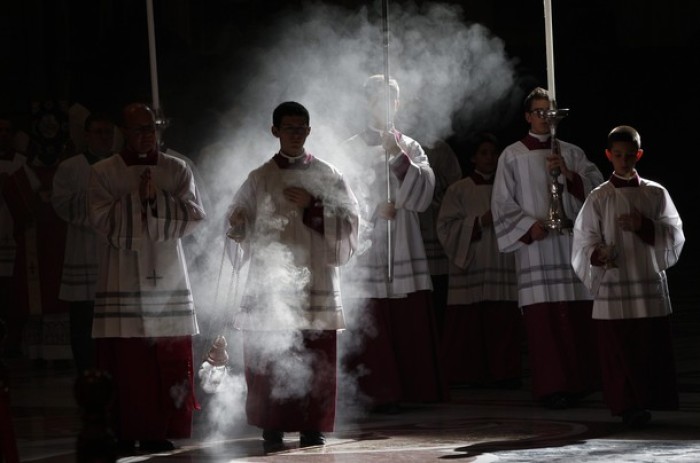 Vatican altar boys with incense during Mass.