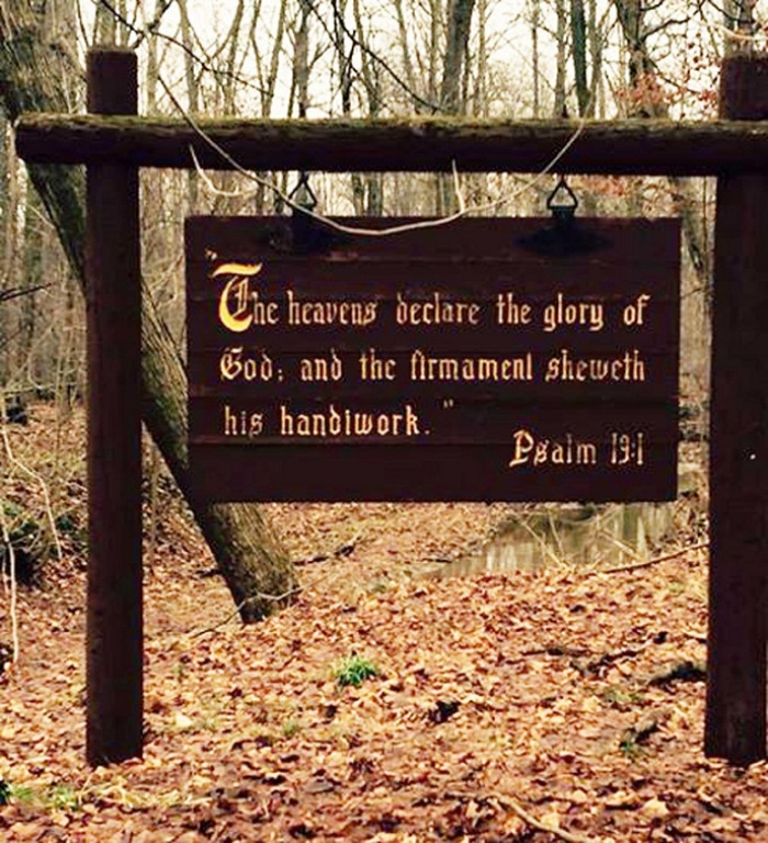 A sign that includes a Bible verse, located at Hager Park in Ottawa County, Michigan.