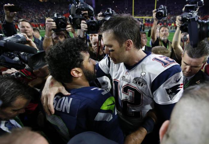 New England Patriots quarterback Tom Brady (12) greets Seattle Seahawks quarterback Russell Wilson (3) after Super Bowl XLIX.