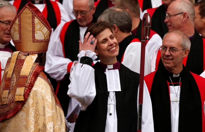The first female bishop in the Church of England Libby Lane adjusts her hair following her consecration service at York Minster in York, northern England, January 26, 2015.