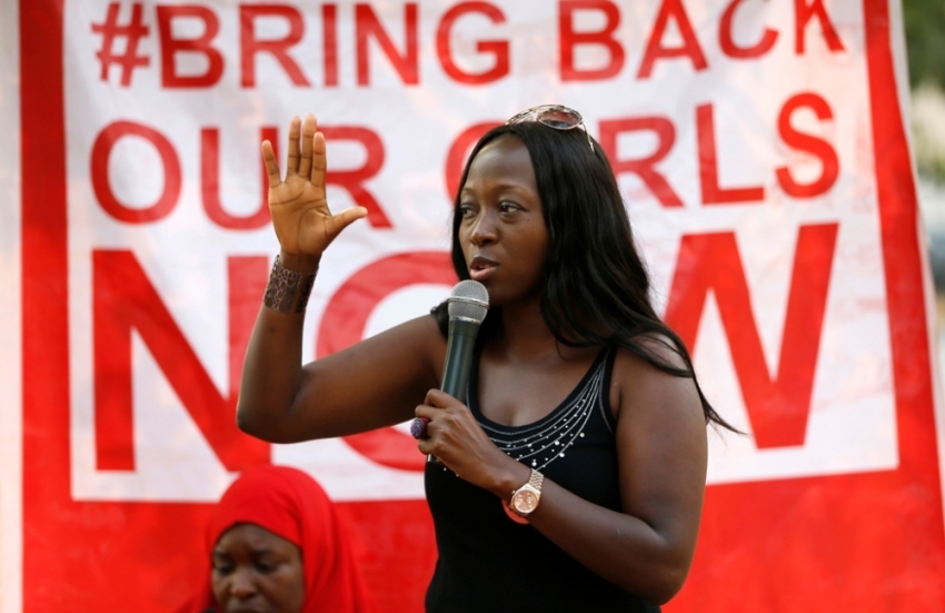 A member gestures while addressing a sit-in demonstration organized by the Abuja
