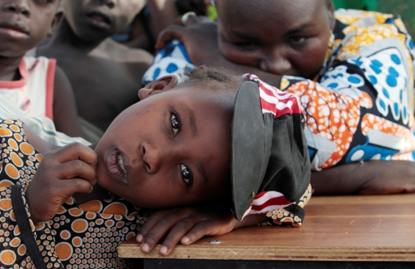 A girl displaced as a result of Boko Haram attack in the northeast region of Nigeria, rests her head on a desk at Maikohi secondary school camp for internally displaced persons in Yola, Adamawa state, Nigeria, January 13, 2015. Boko Haram says it is building an Islamic state that will revive the glory days of northern Nigeria's medieval Muslim empires, but for those in its territory life is a litany of killings, kidnappings, hunger and economic collapse.